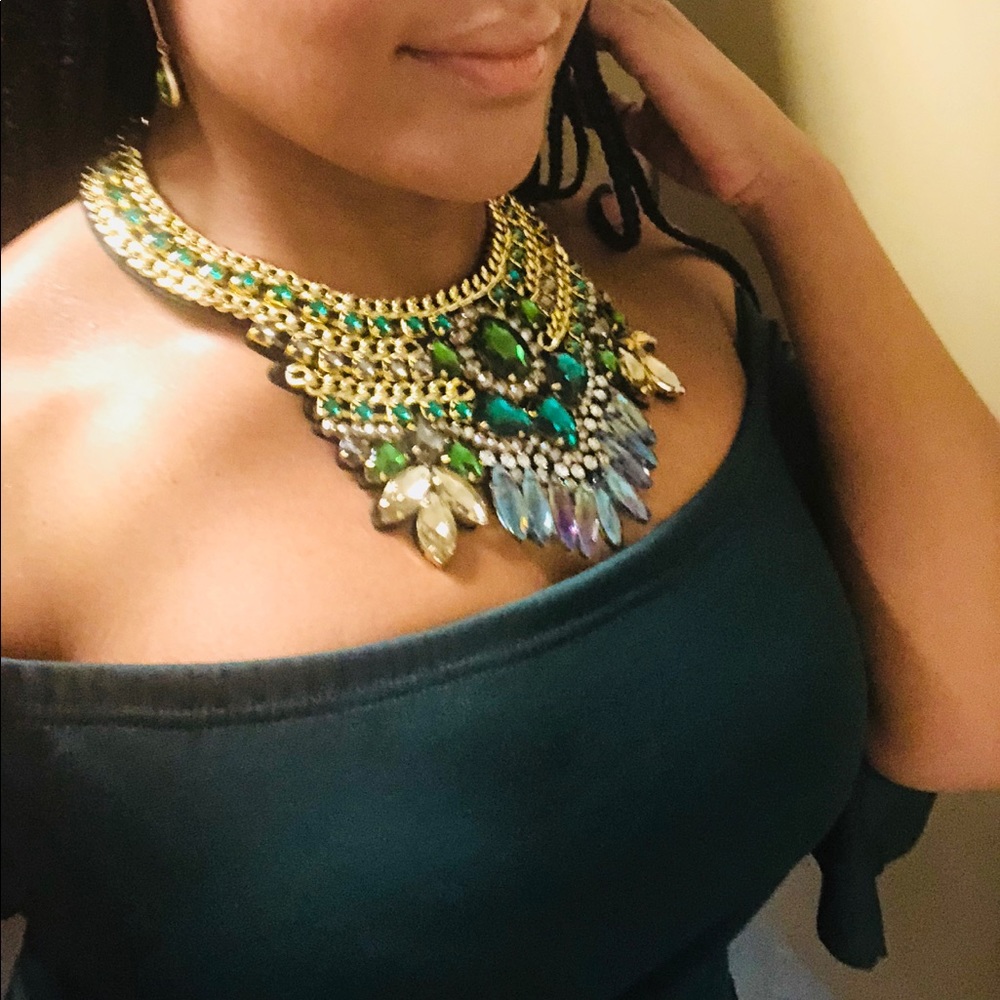 Costume necklace embellished primarily with green.